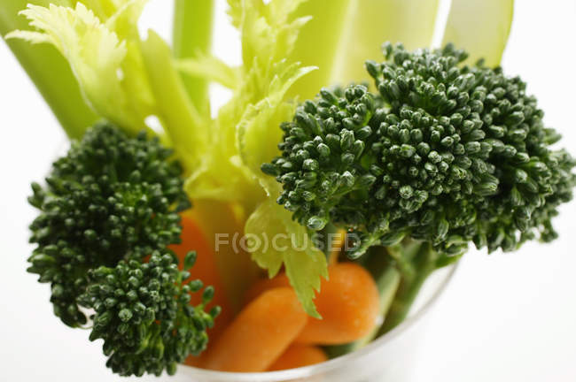Carrots and broccoli in glass — Stock Photo