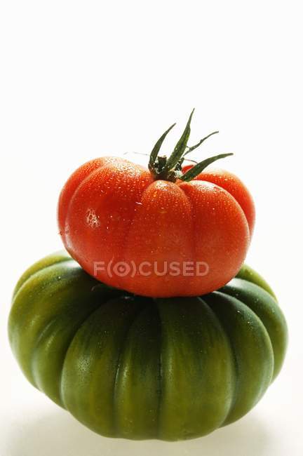 Green and red beefsteak tomatoes — Stock Photo