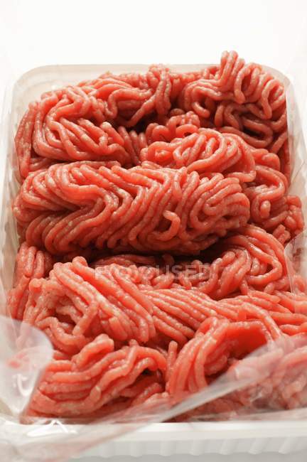 Fresh minced beef in plastic container — Stock Photo