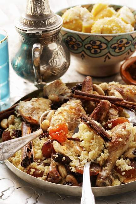 Couscous with chicken on plate — Stock Photo