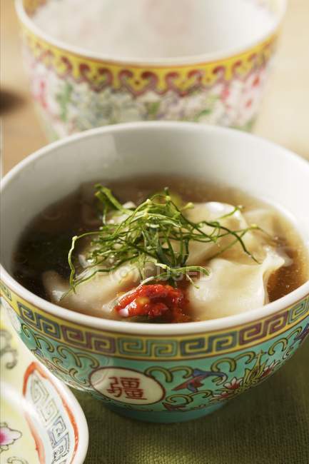 Broth with won tons — Stock Photo