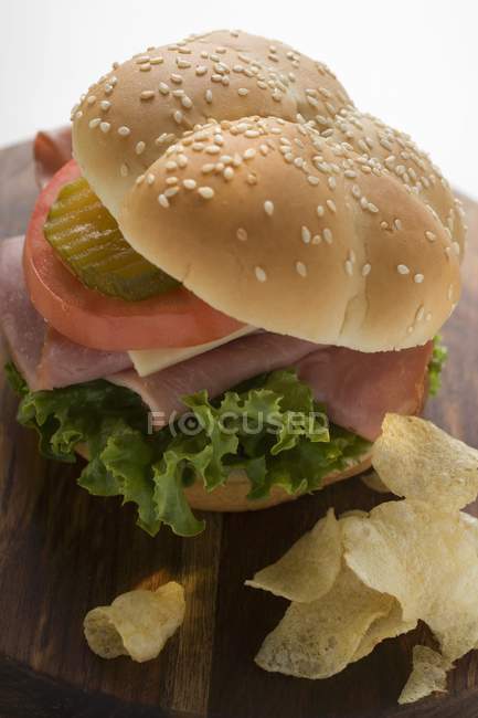 Tomato and gherkin in roll — Stock Photo