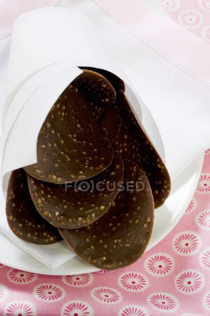 Chocolate curves with nuts — Stock Photo