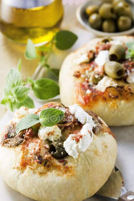 Mini-pizzas with olives — Stock Photo
