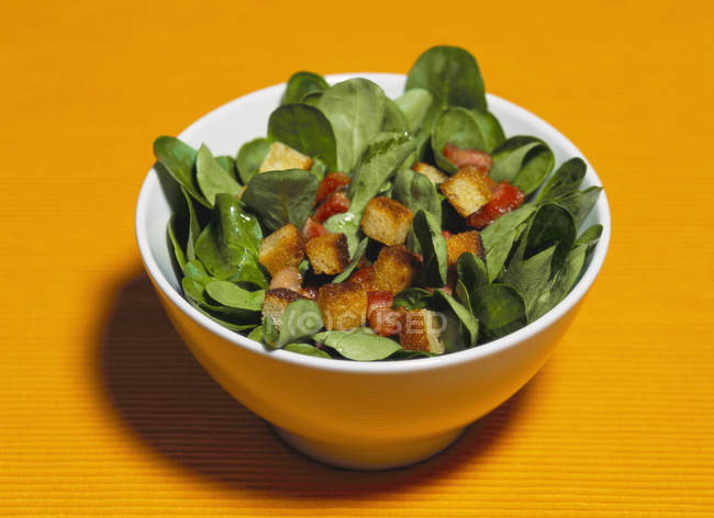 Corn salad with croutons — Stock Photo