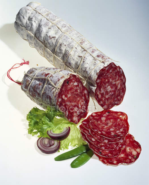 Partly sliced French salami — Stock Photo