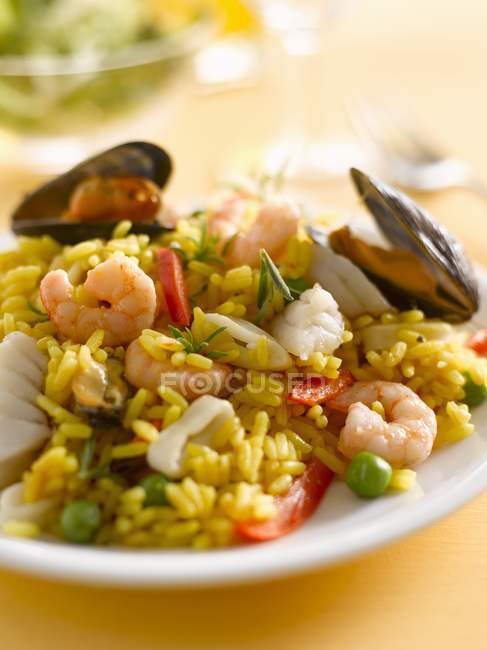 Paella with mussels on plate — Stock Photo