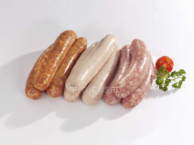 Fresh raw sausages — Stock Photo