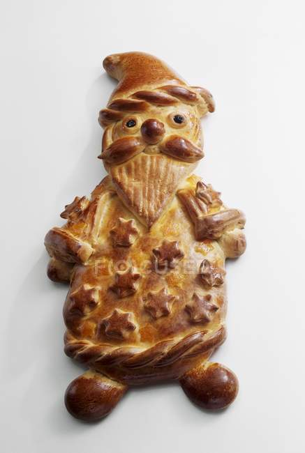 Closeup top view of yeast dough Father Christmas on white surface — Stock Photo