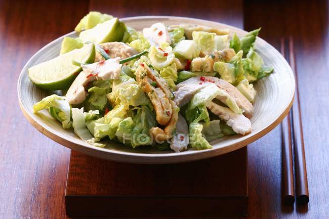 Green salad with turkey breast and lime — Stock Photo