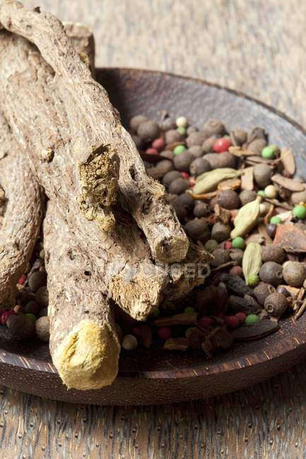 Mixed spices in rustic wooden dish — Stock Photo