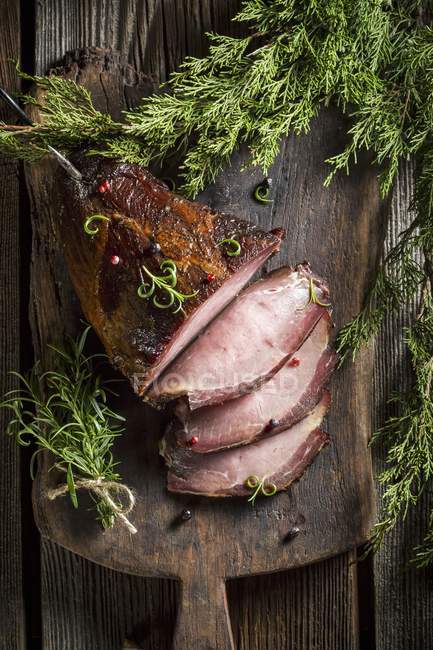 Smoked ham with herbs — Stock Photo