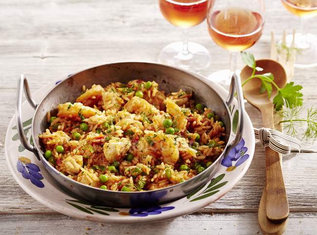 Fiesta Paella from Florida in bowl over plate on table with fork — Stock Photo