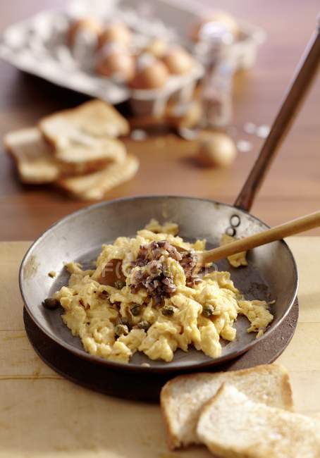 Closeup view of Scotch Woodcock with scrambled eggs, anchovies and capers — Stock Photo