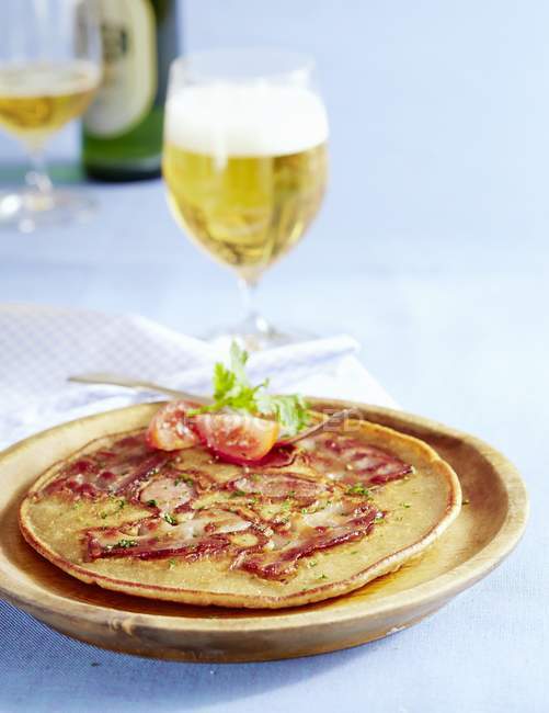 Bacon pancake and glass of tasty beer — Stock Photo