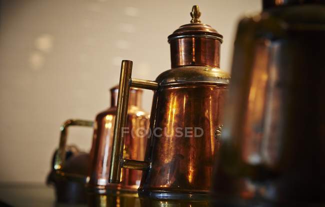 Closeup view of antique copper cans — Stock Photo