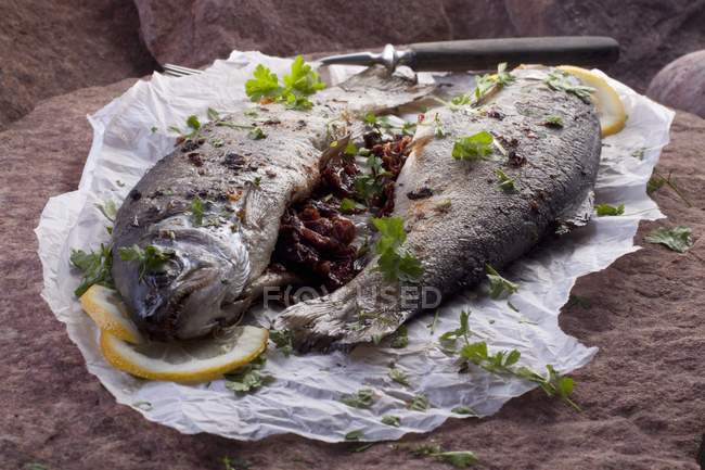 Fried trouts with tomatoes — Stock Photo