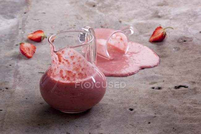 Strawberry smoothies in jug — Stock Photo
