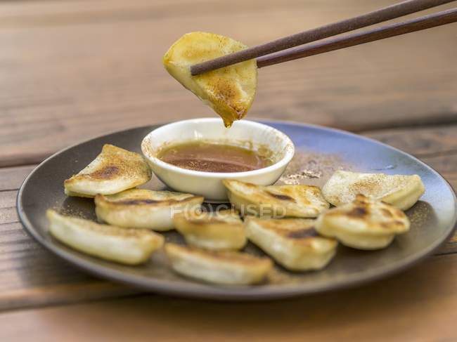 Closeup view of Momos Nepalese dumplings with a dip — Stock Photo