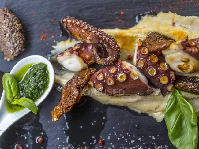 Squid on a bed of polenta — Stock Photo
