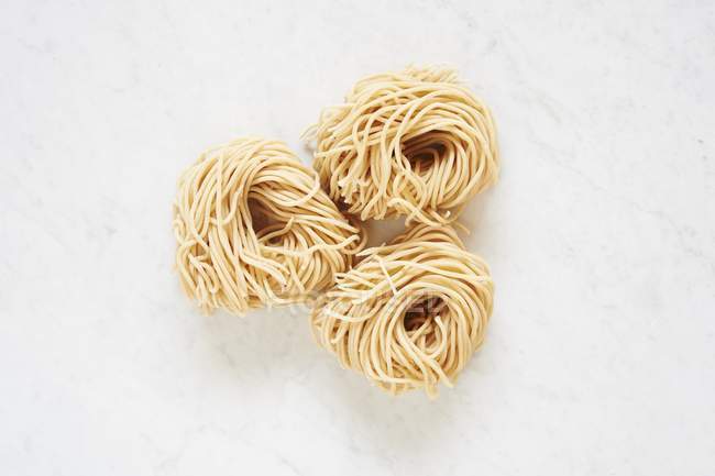 Uncooked pasta nests — Stock Photo