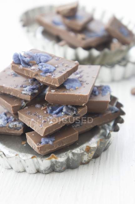 Violet chocolate stacked — Stock Photo