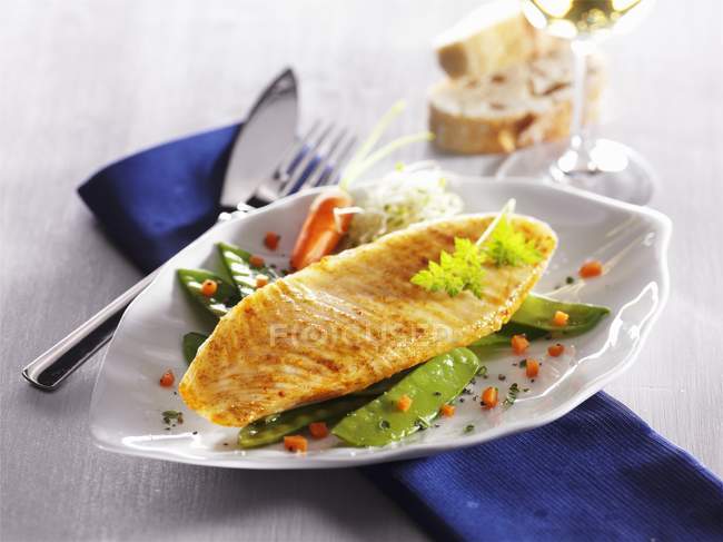 Catfish fillet on bed — Stock Photo