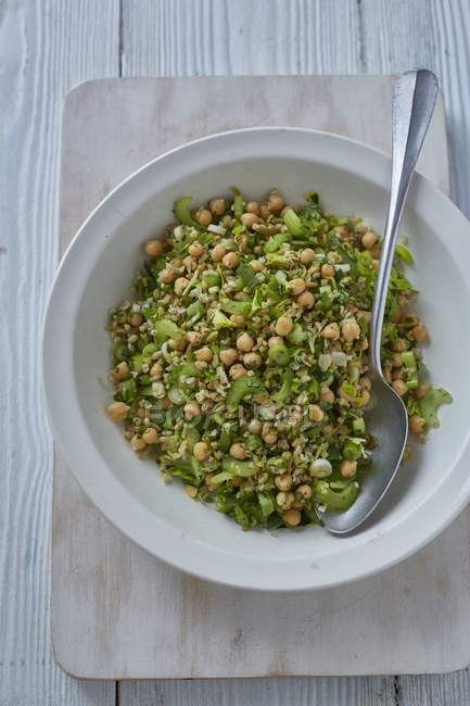 Freekah chickpea salad with celery and herbs — Stock Photo