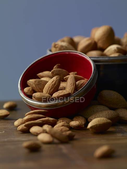 Almonds in a bowl on table — Stock Photo