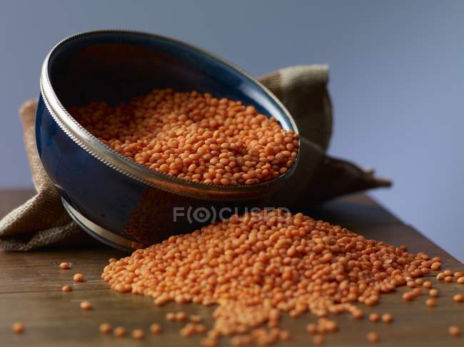 Red lentils in bowl — Stock Photo
