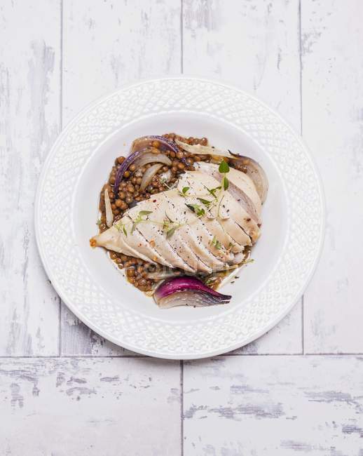 Chicken breast with lentil medley and chilli — Stock Photo