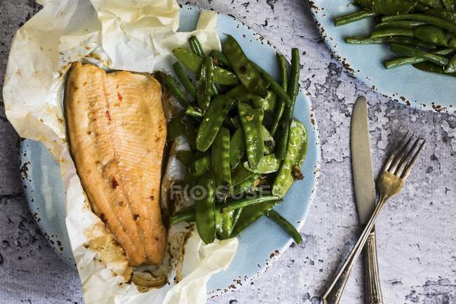 Fish baked in paper — Stock Photo