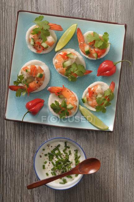 Top view of canapes with prawns, herbs and chive dip — Stock Photo