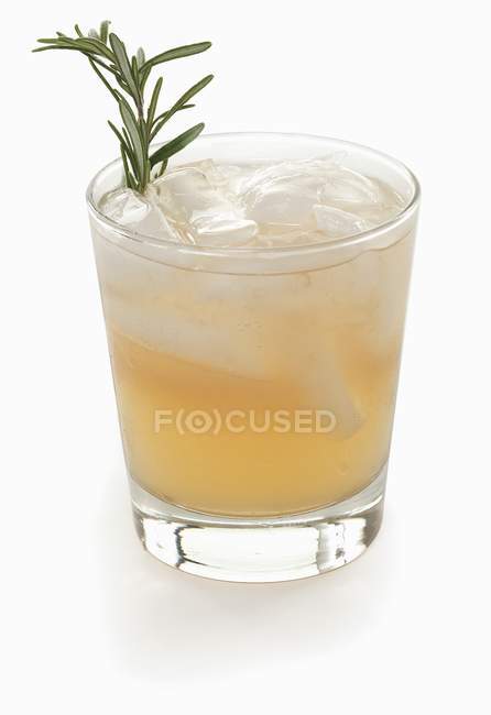 Cocktail with ice and rosemary — Stock Photo