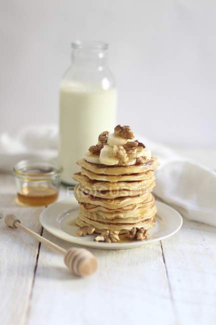 Stack of pancakes with bananas — Stock Photo