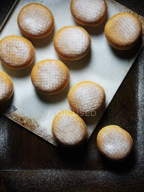 Sugared doughnuts on tray — Stock Photo
