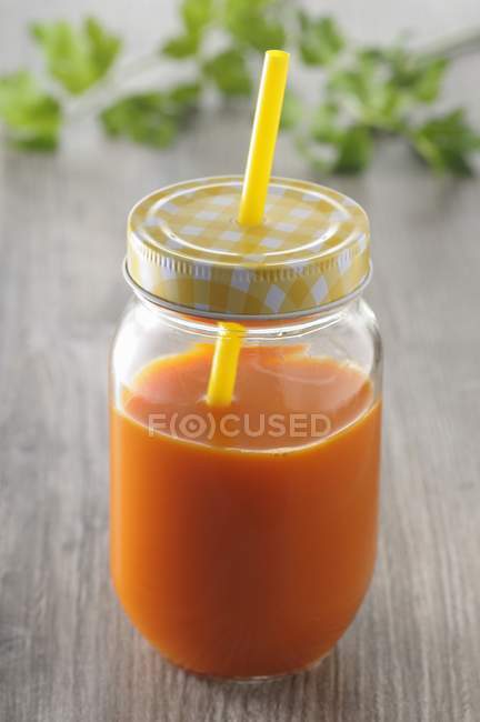 Carrot juice in jar — Stock Photo