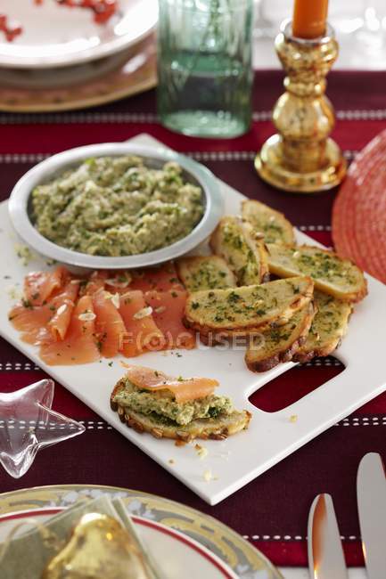 Garlic crostini with smoked salmon — Stock Photo