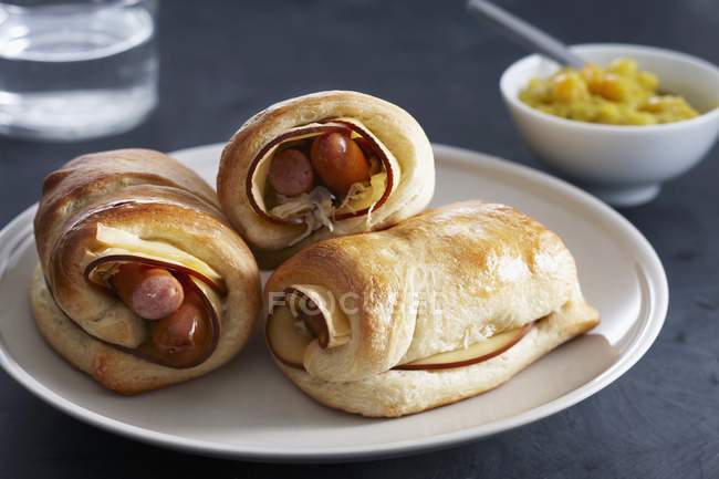 Sausage rolls with cheese — Stock Photo