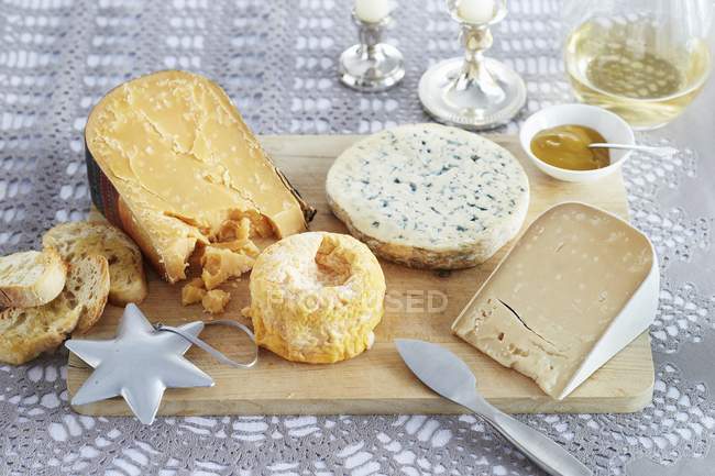 Cheese wooden board — Stock Photo