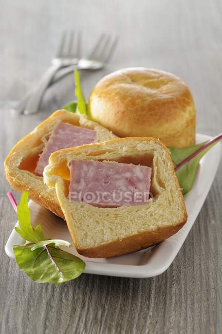 Brioche filled with sausage — Stock Photo