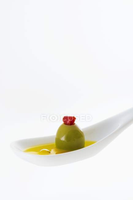 Stuffed olive in olive oil — Stock Photo