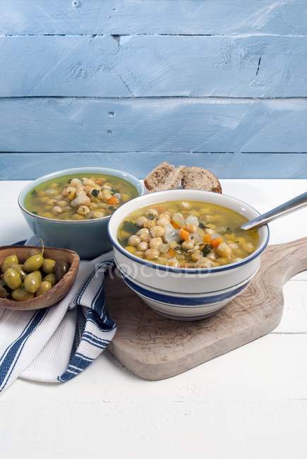 Greek Chickpea soup and olives — Stock Photo