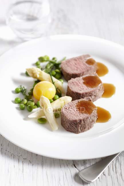 Lamb fillet with asparagus — Stock Photo