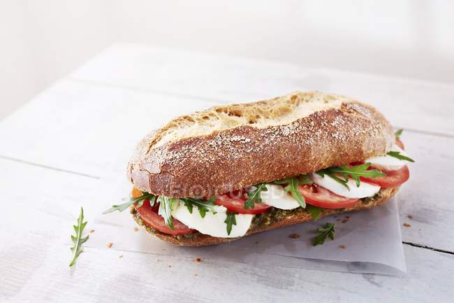 Baguette with mozzarella and rocket — Stock Photo