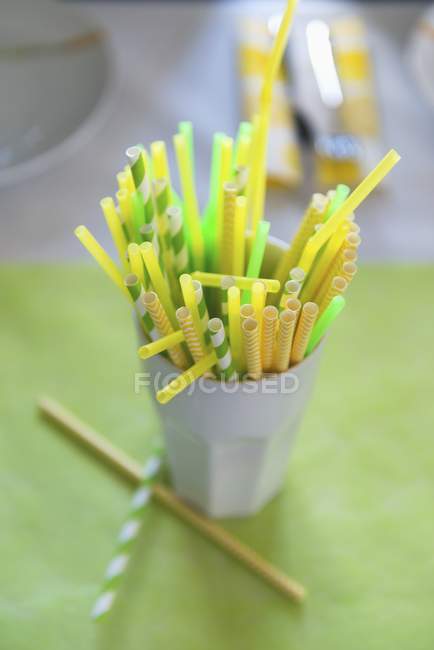 Closeup view of colored drinking straws in a white cup — Stock Photo