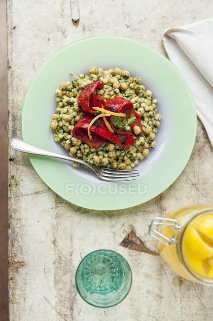 Israeli couscous dish with peppers — Stock Photo