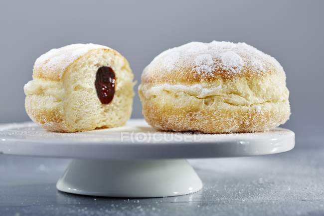 Doughnuts with icing sugar and jam — Stock Photo