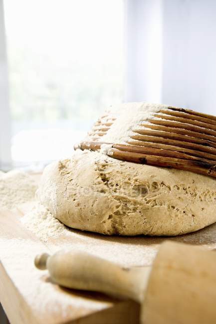 Wheat and rye dough with baking basket — Stock Photo