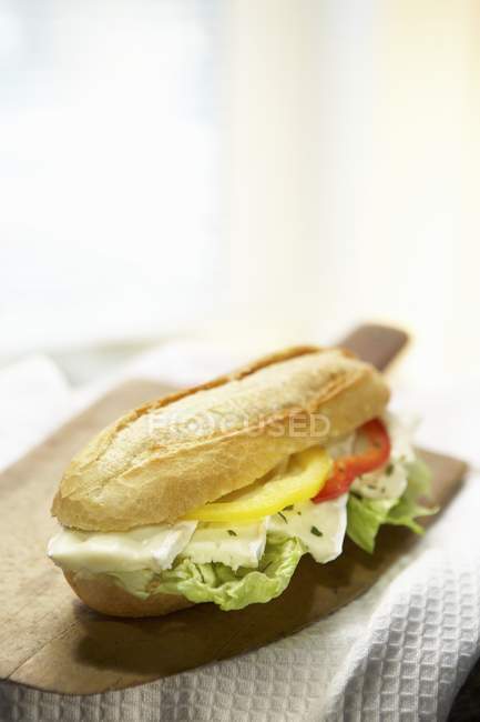 Baguette roll with brie and pepper — Stock Photo